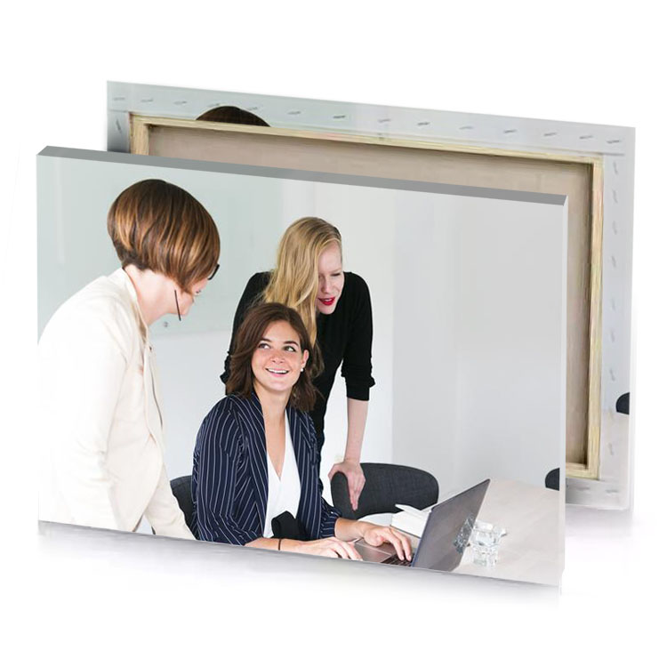 three women sitting at a table with laptop platinum canvas