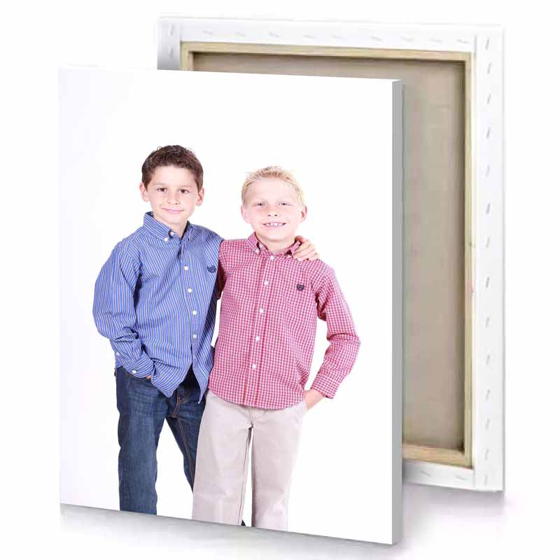 two boys in shirts and jeans posing for a picture snow canvas