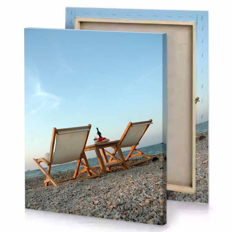 two empty chairs on the beach pale turquoise canvas