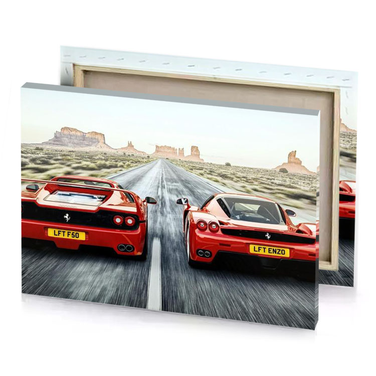 two ferraris driving down a road in the desert firebrick canvas
