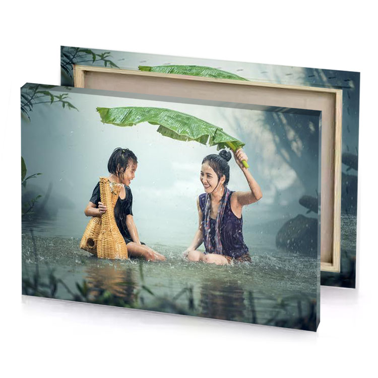 two girls sitting in the water with an umbrella charcoal canvas