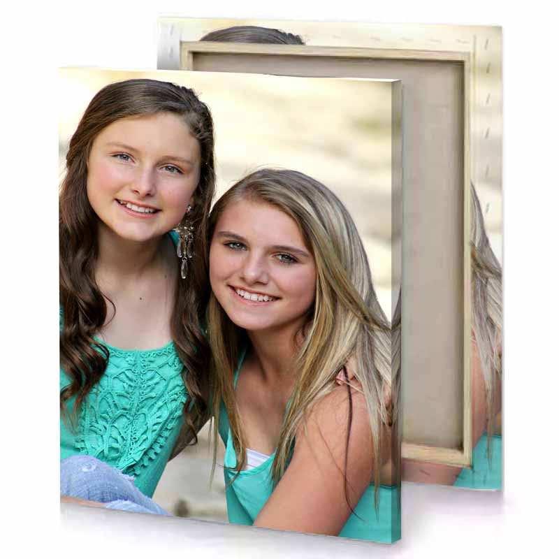 two girls sitting on a bench beige canvas