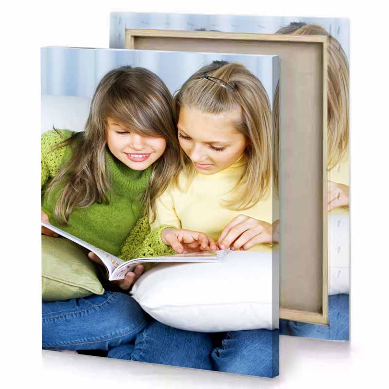 two girls sitting on a couch reading book dark cornflower blue canvas