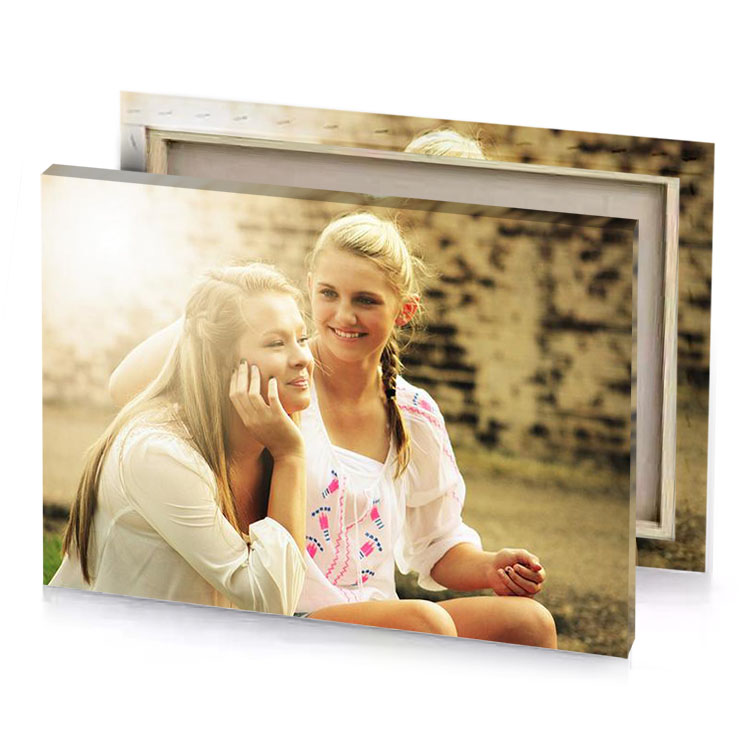 two girls sitting on the ground champagne canvas