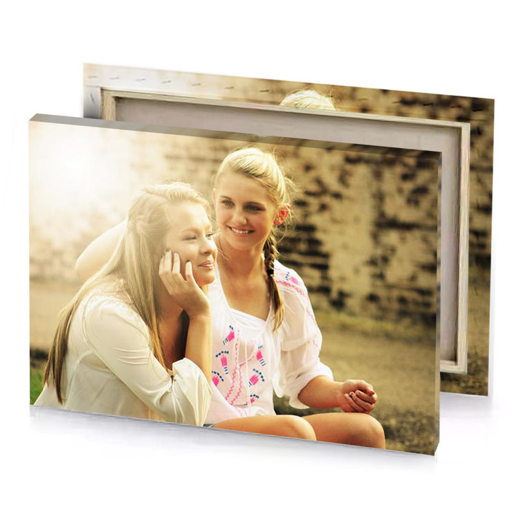 two girls sitting on the ground talking their cell phones champagne canvas