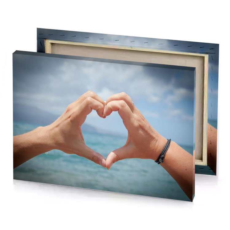 two hands making a heart shape with the ocean in light steel blue canvas