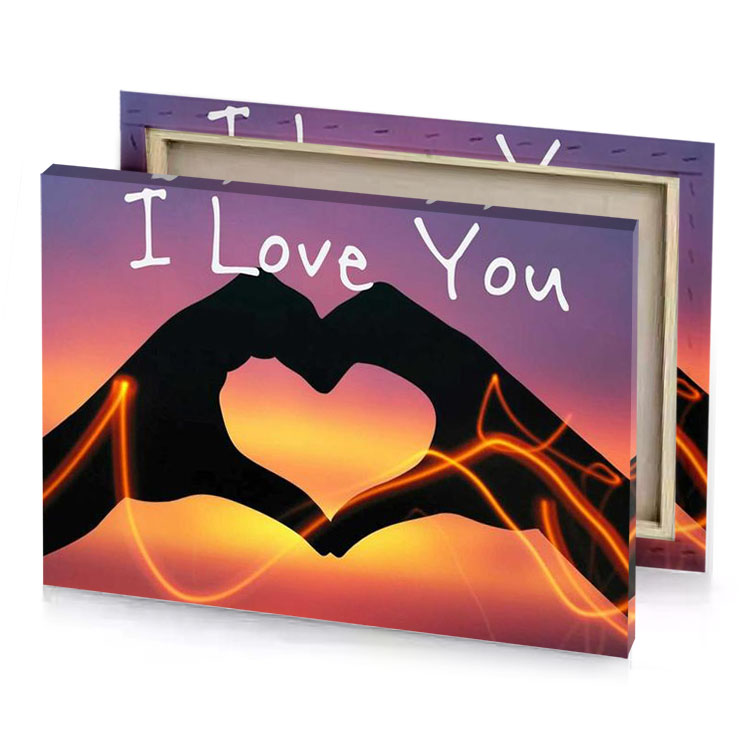 two hands making a heart with the words i love sand brown canvas