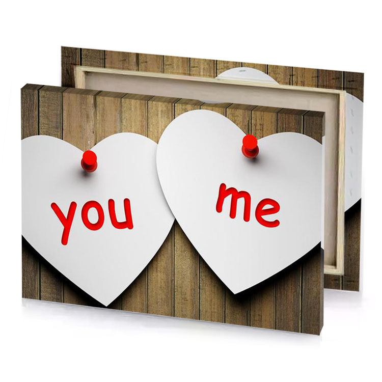 two hearts with the words you and me written on platinum canvas