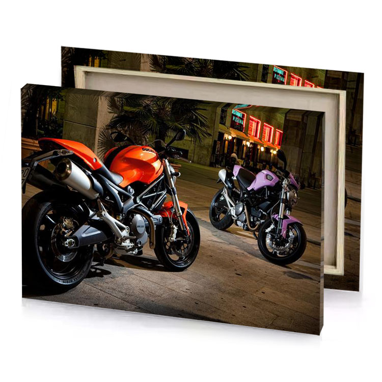 two motorcycles parked on a city street at night firebrick canvas