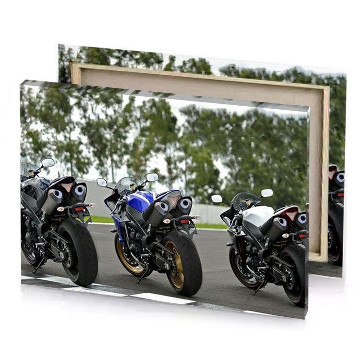 two motorcycles parked on a race track dark olive green canvas
