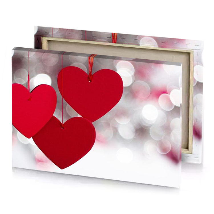 two red hearts hanging from strings on a string firebrick canvas