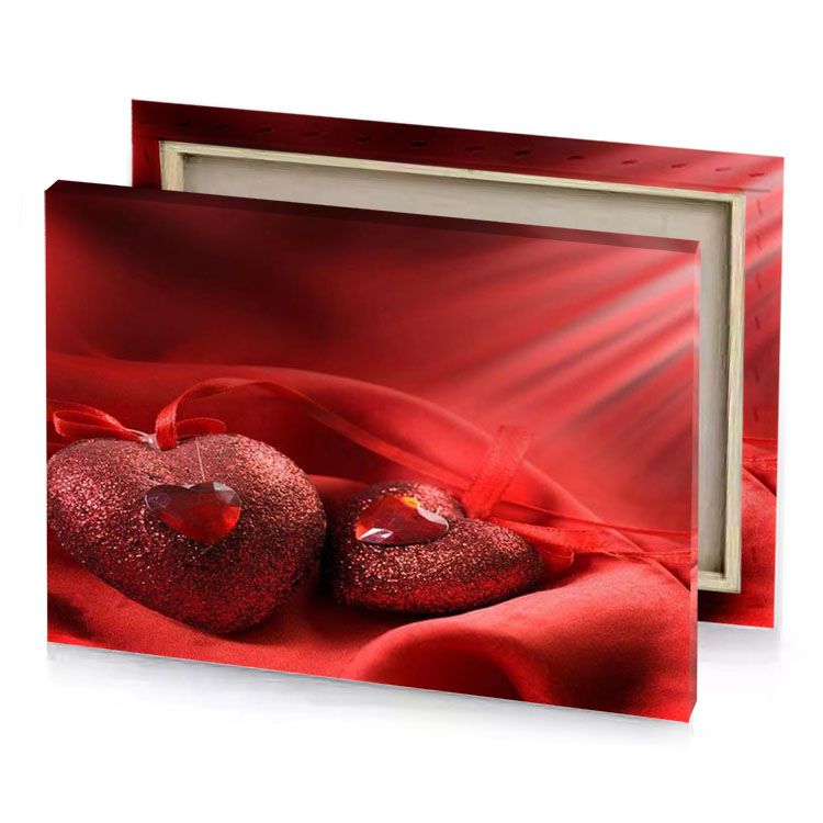 two red hearts on a satin brown canvas