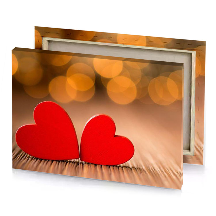 two red hearts on a wooden table canvas