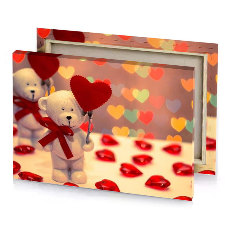 two teddy bears holding hearts on a table maroon canvas