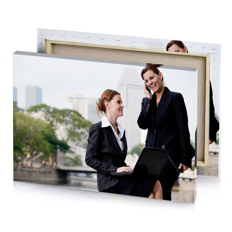 two women in business attire talking on a cell platinum canvas