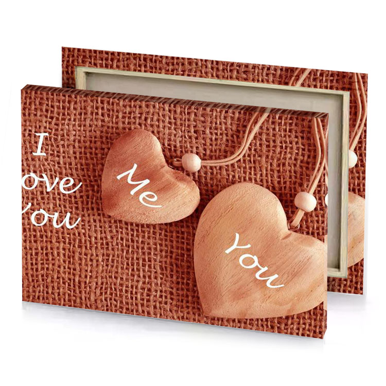two wooden hearts with the words i love you maroon canvas