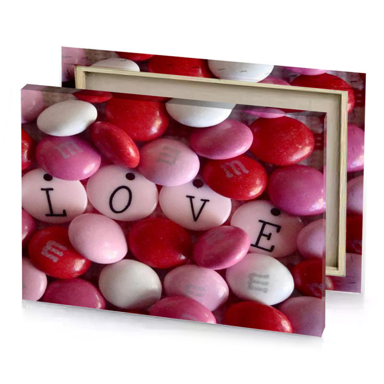 valentine candys with the word love spelled on them maroon canvas